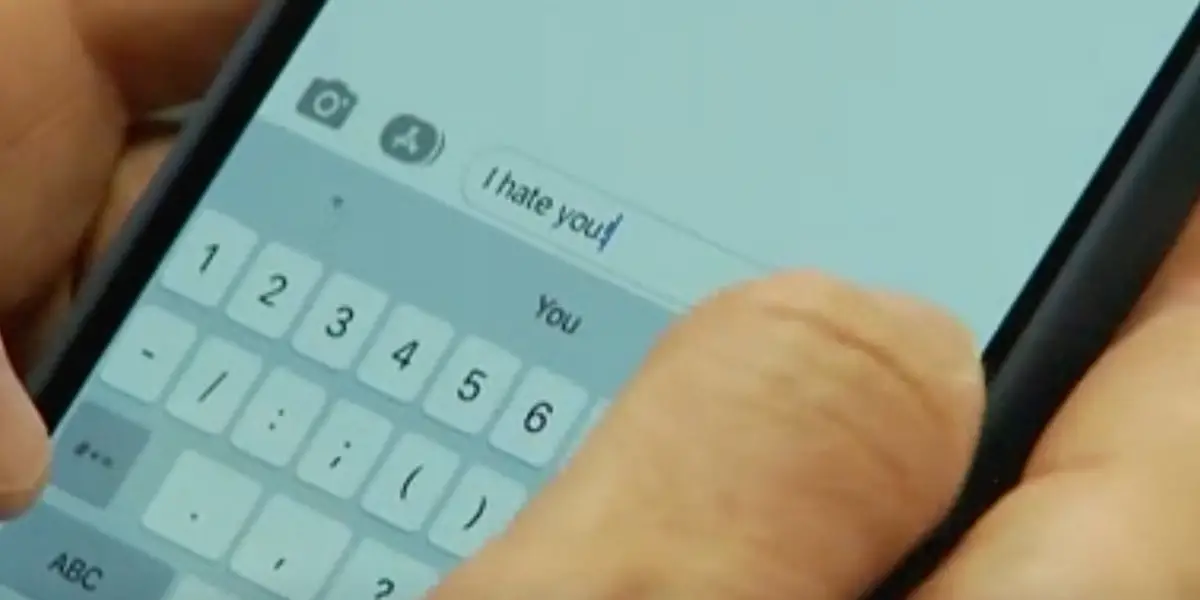 Person texting 'I hate you!'.