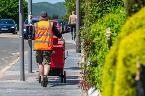 Postman in shorts.