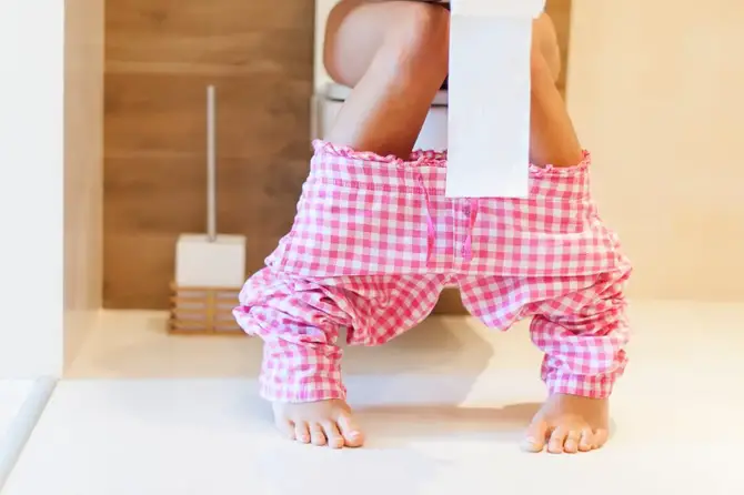 Woman on the toilet.