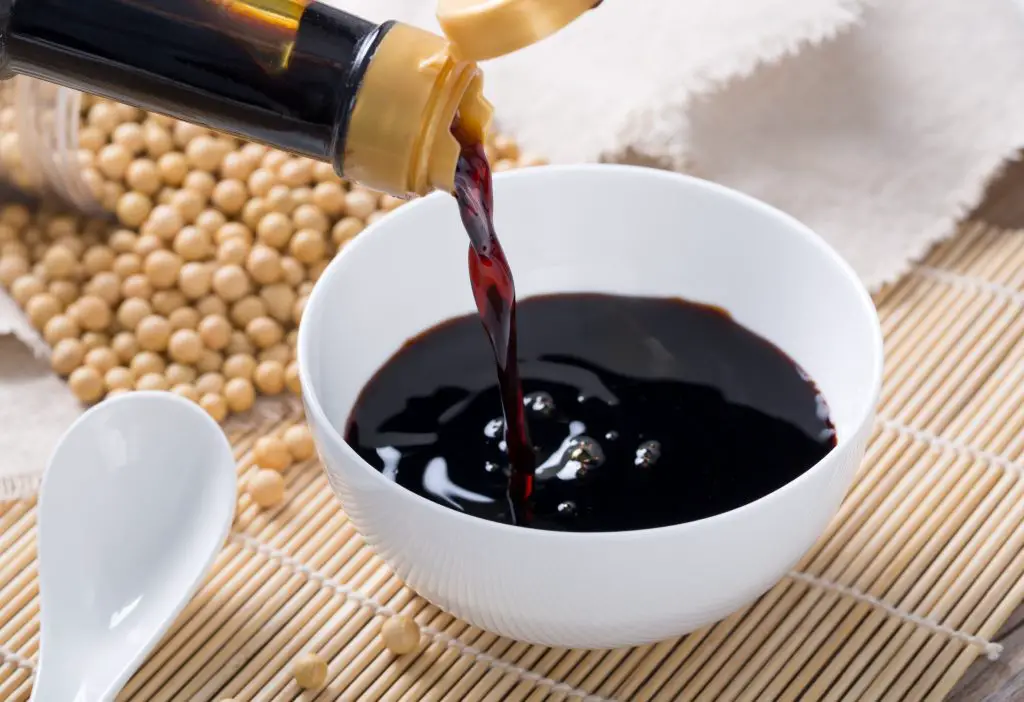 Pouring of soy sauce.
