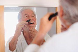 Man removing nose hair.