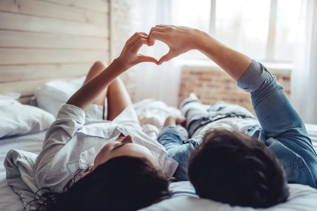 Couple in bedroom.