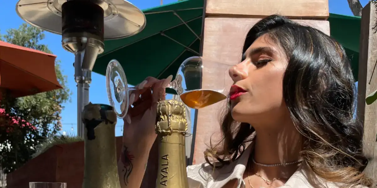 Mia Khalifa drinking wine. 