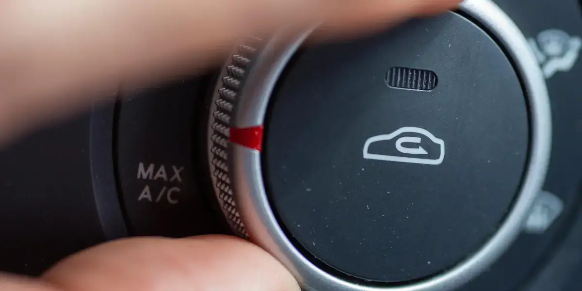 Air recirculation button in car. 