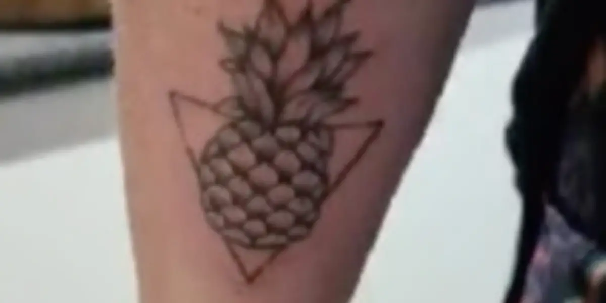 Upside-down pineapple tattoo.