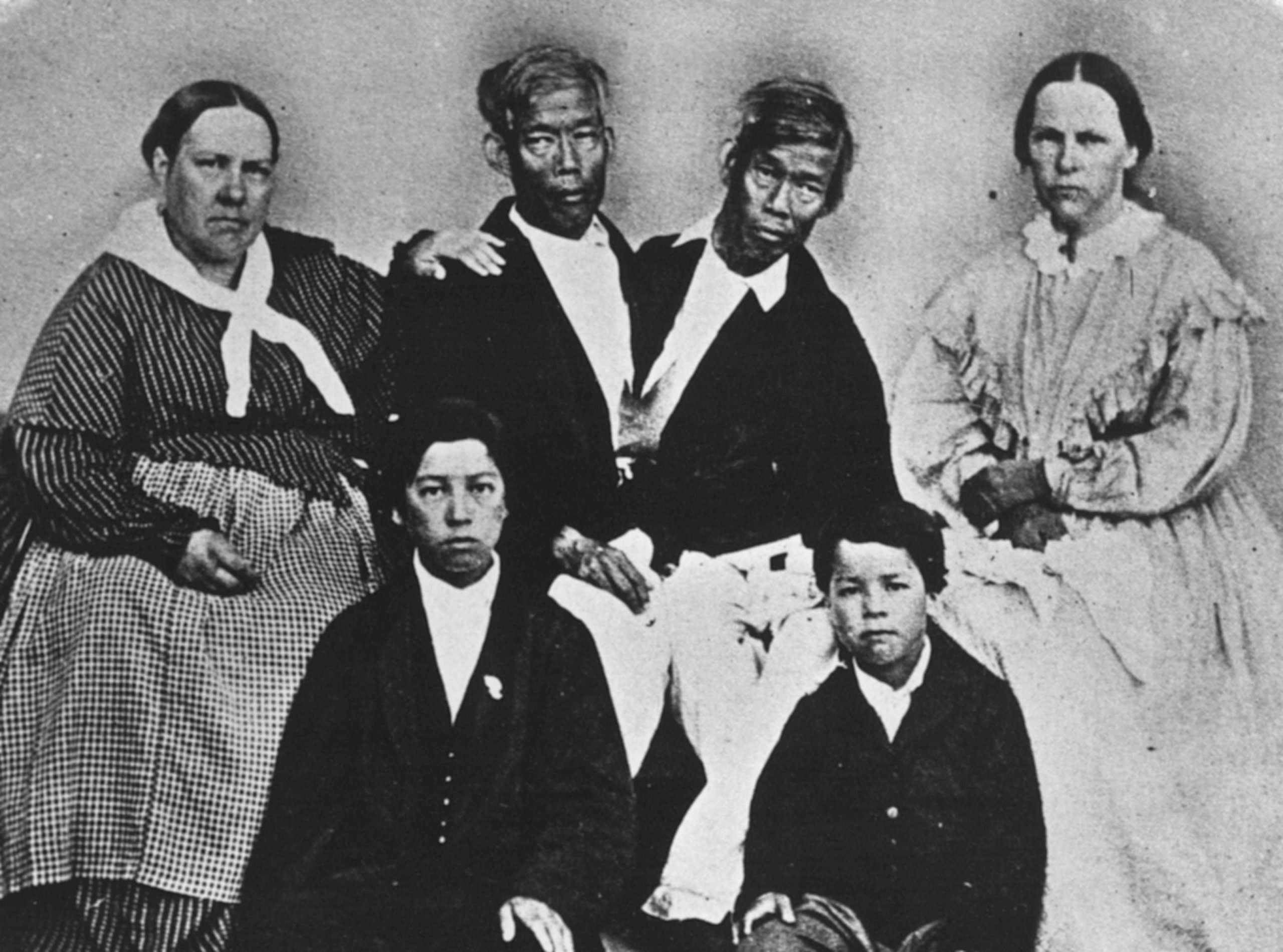 Chang and Eng with their wives. 