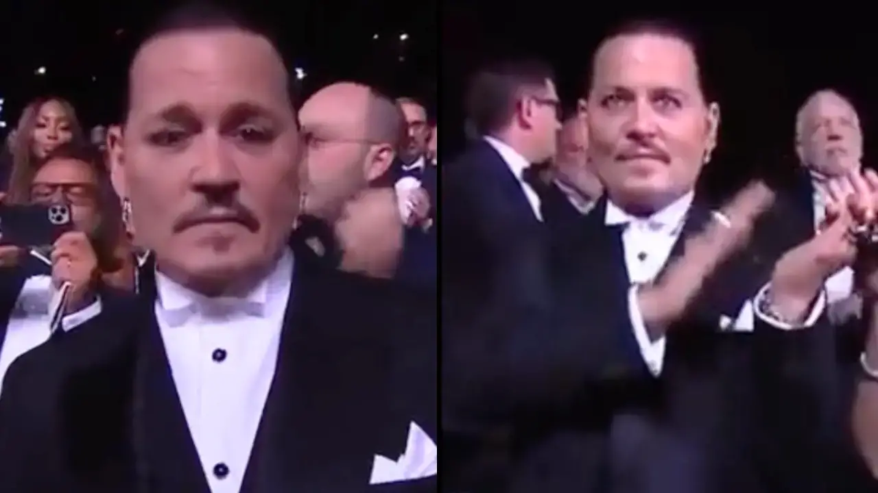 ohnny Depp holds back tears as he receives a standing ovation for his new movie.