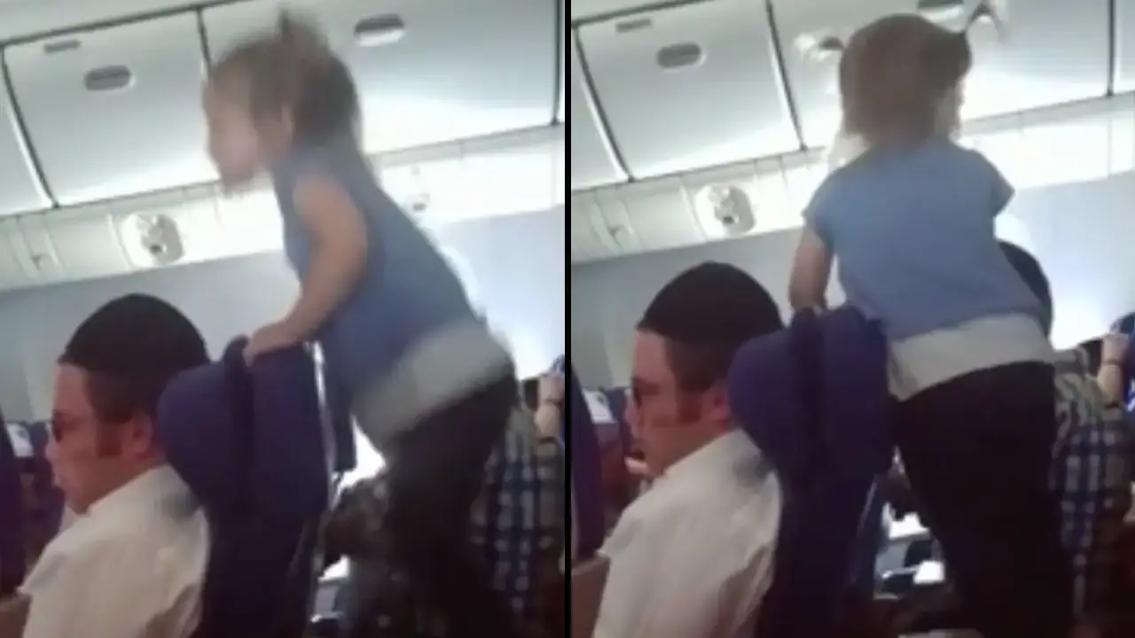 Parents with their toddler during a flight have been slammed after letting the infant jump up and down on a tray table.