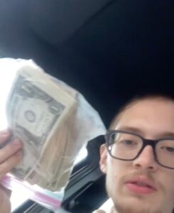 Josiah Vargas and money in a bag from McDonalds