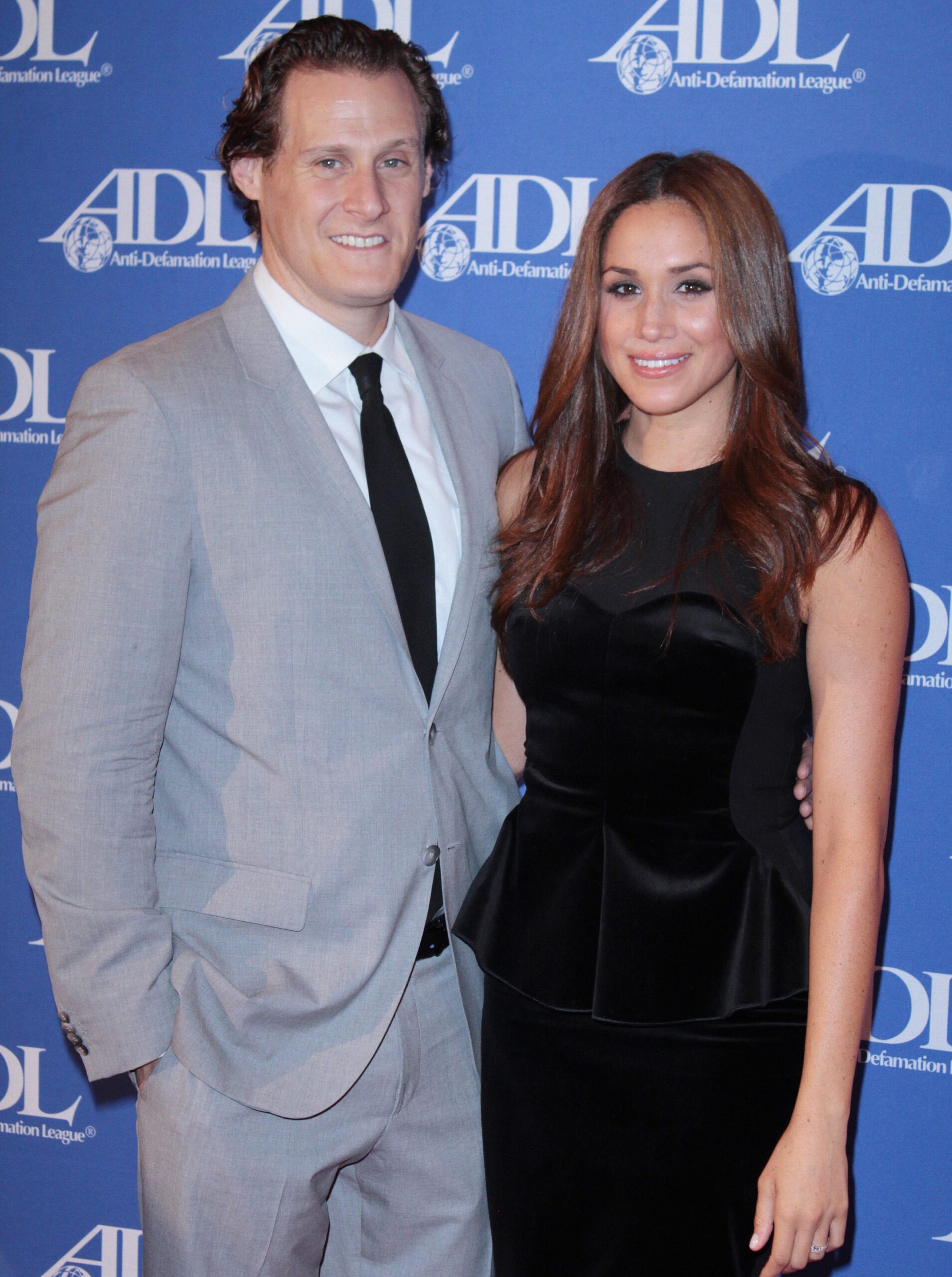 Trevor Engelson and Meghan Markle. 