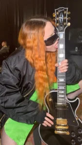 Madonna licking her guitar