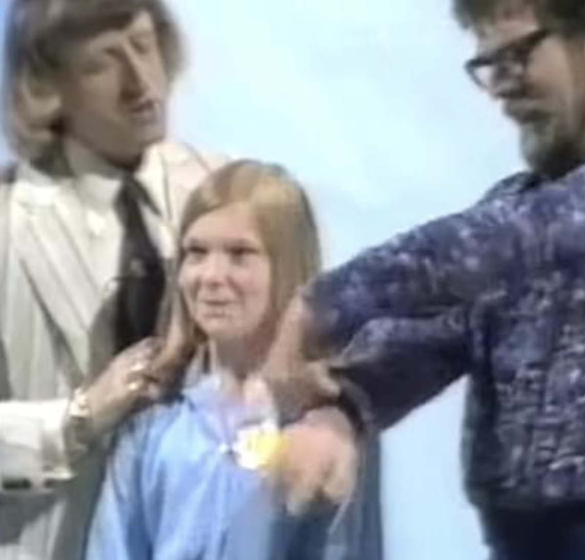 Jimmy Savile, a young girl and Rolf Harris. 