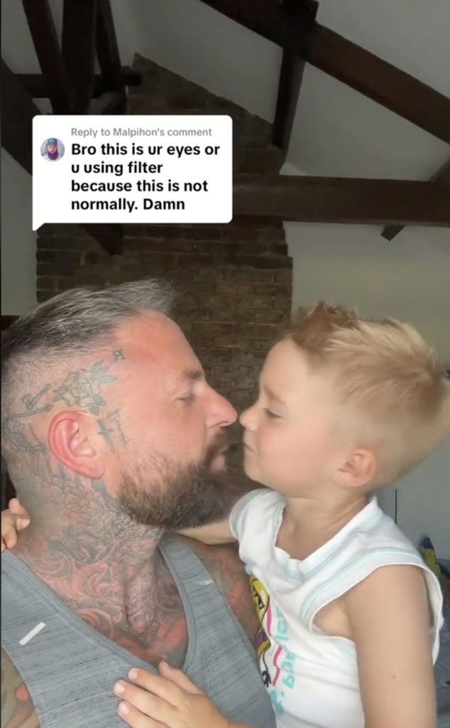 Dad kisses son on the lips