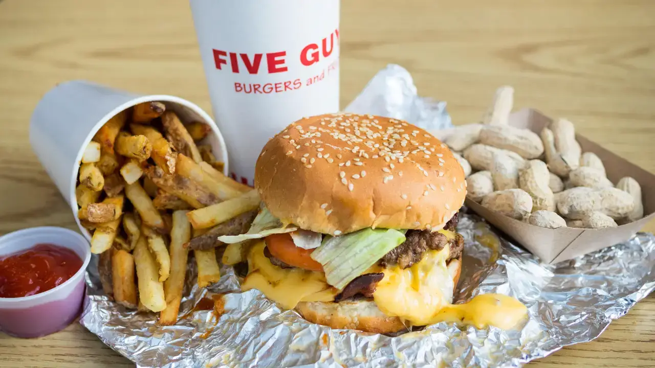 It's finally been revealed why Five Guys leaves so many extra fries at the bottom of the bag. 