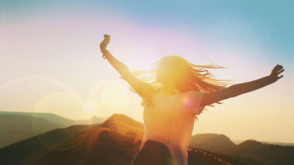 Happy woman running.