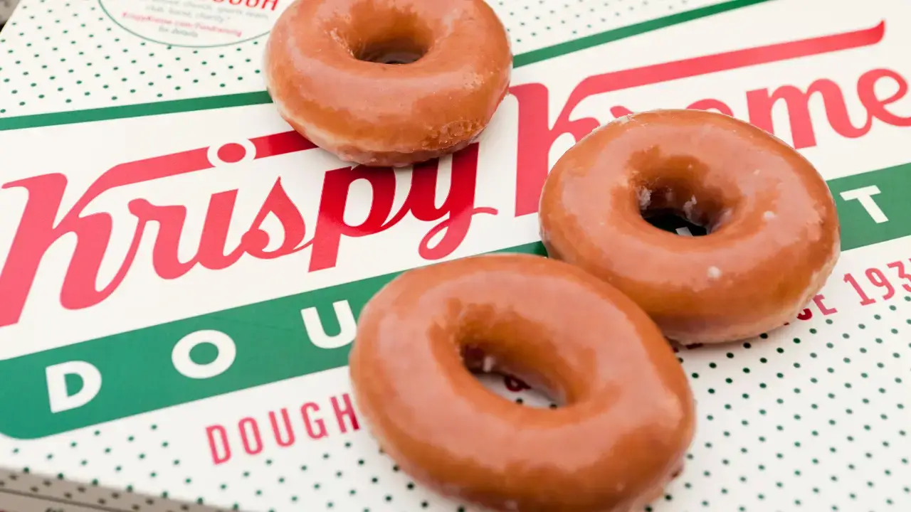 Krispy Kreme has apologised after a racial slur in a doughnut advert was spotted and branded 'an absolute disgrace'.