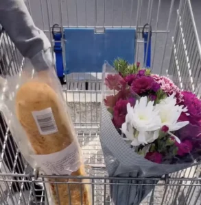 Trolley with baguette and flowers in.