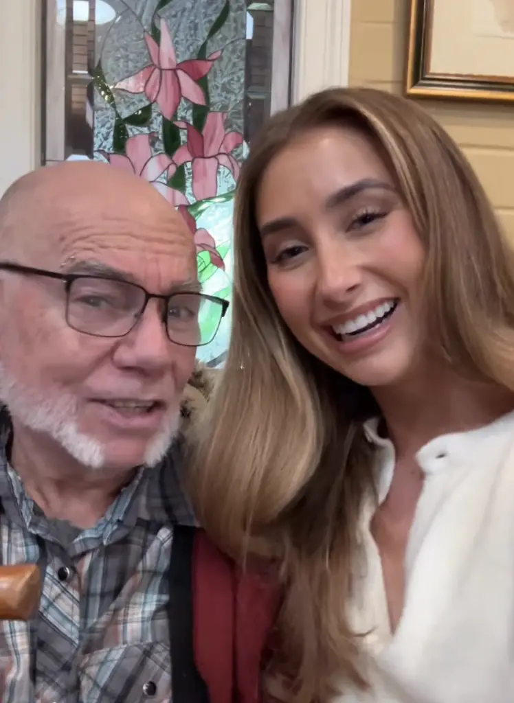 Elderly man with Lily Phillips. 