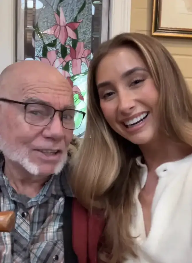 Elderly man with Lily Phillips.