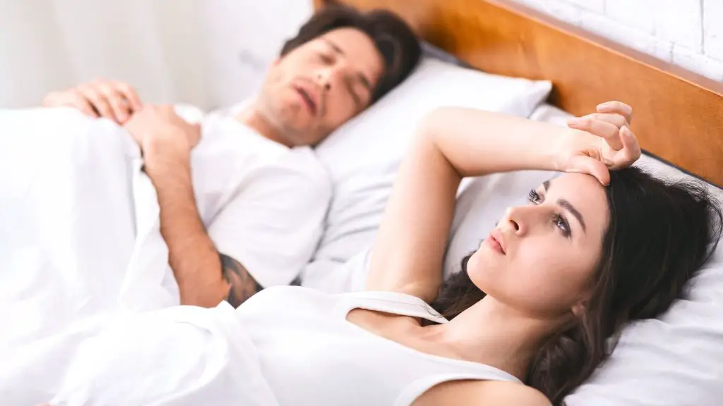 Man and woman in bed.