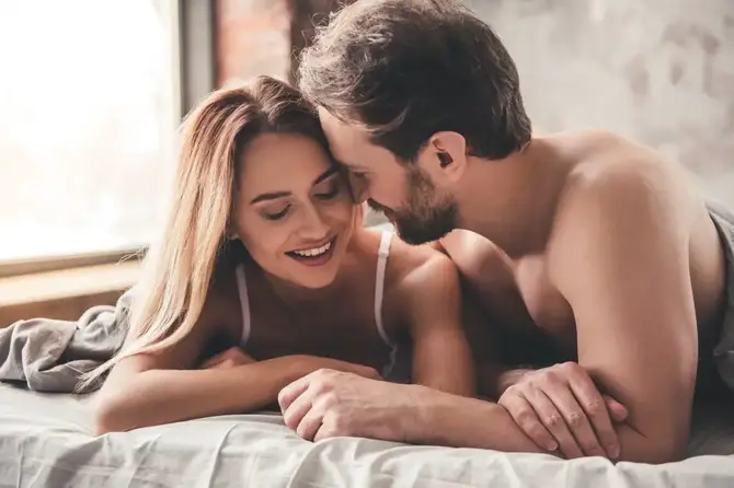 Couple in bed.