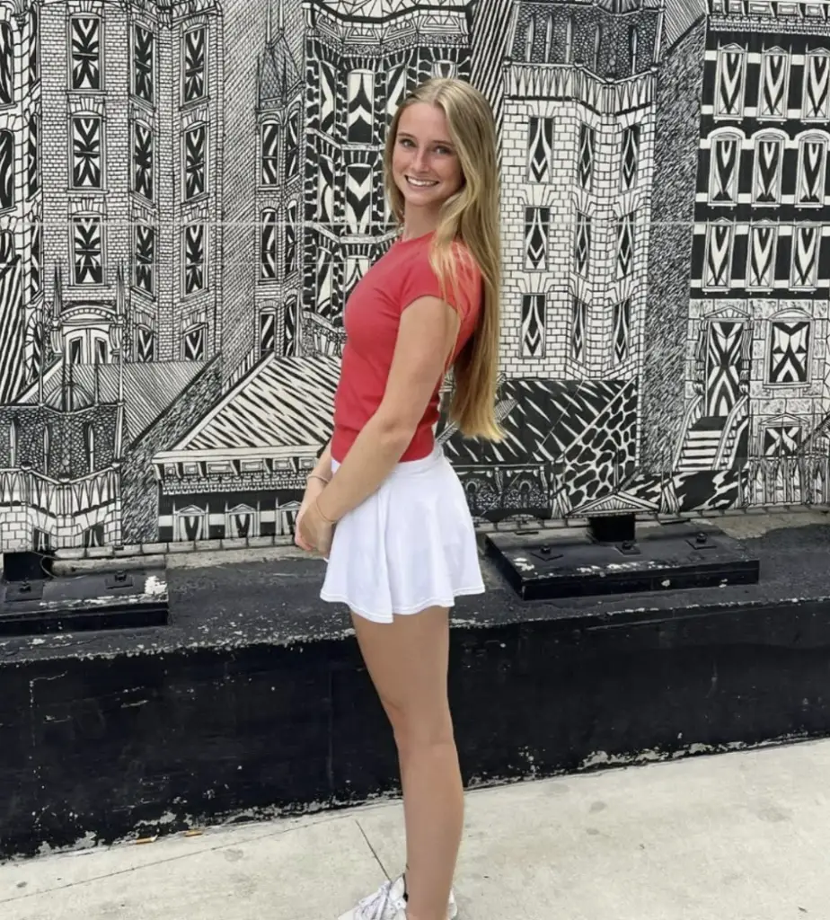 Anna Grace Phelan posing against a black and white wall.