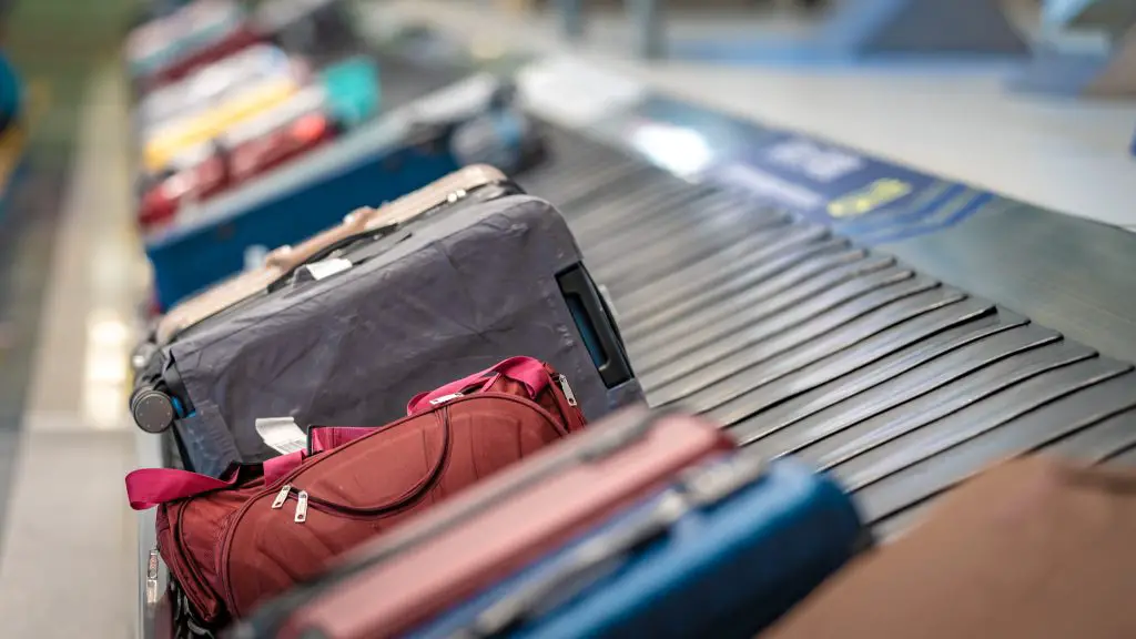 Suitcases on a conveyor belt.