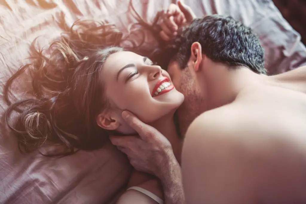 Couple happy in the bedroom.