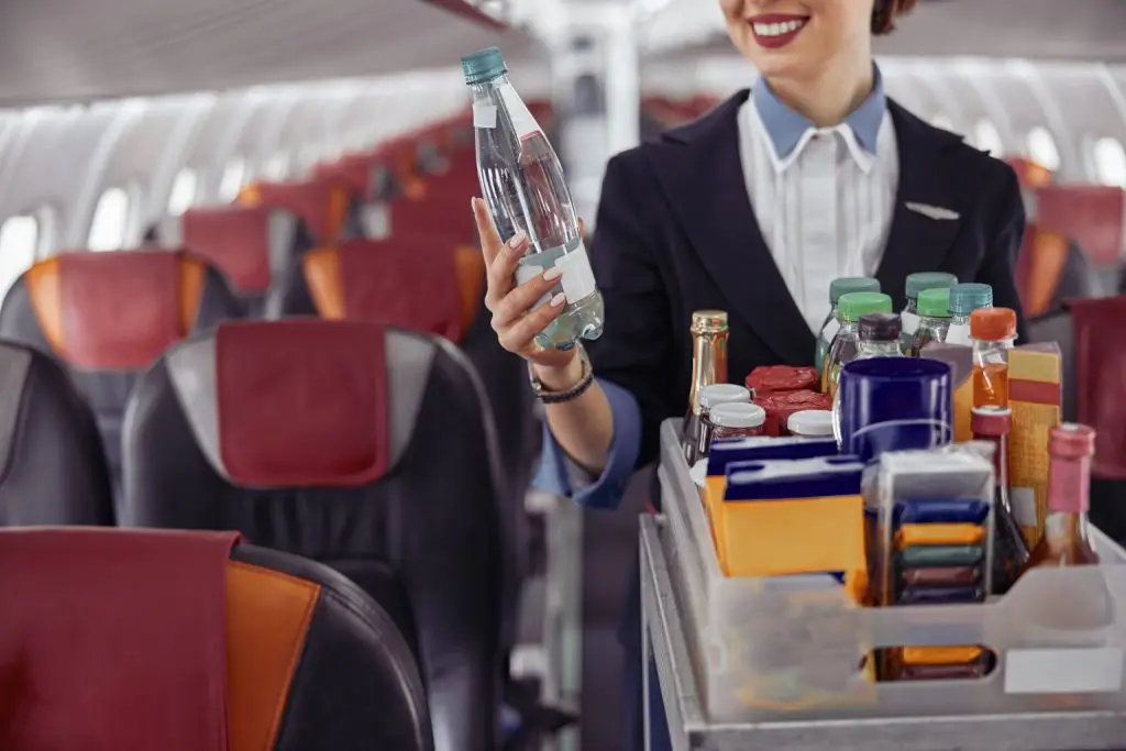 Flight attendant with drinks.