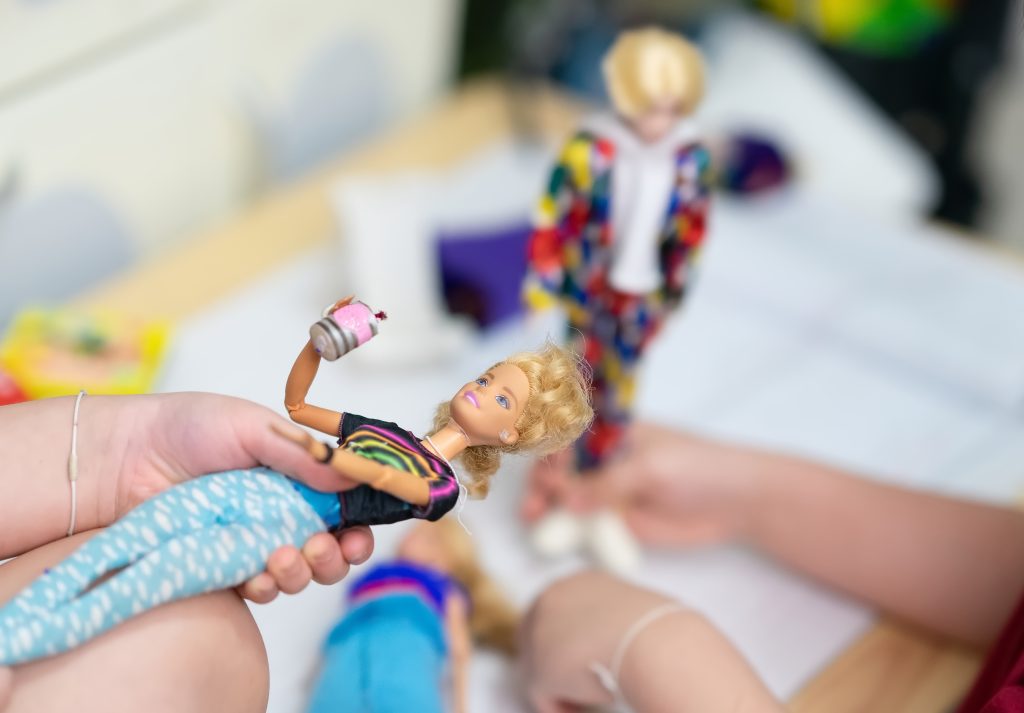 kids playing with Barbie