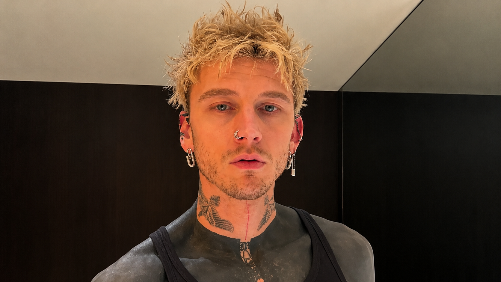 Machine Gun Kelly Reveals Terrifying Side Effect After Covering Body In Blacked Out Tattoo